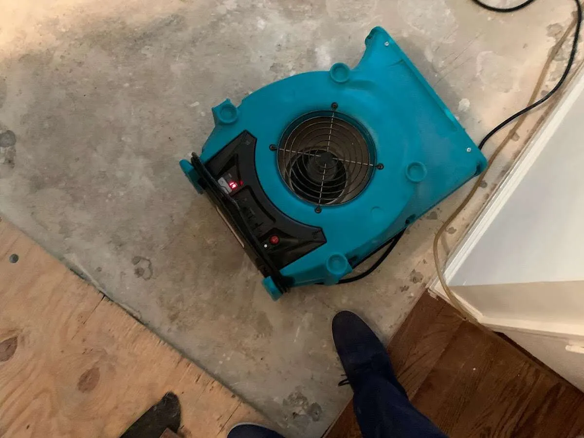 Air mover drying subfloor during Commercial Water Damage Restoration in Indian Wells